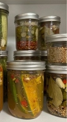 Shelf of pickled vegetables in mason jars